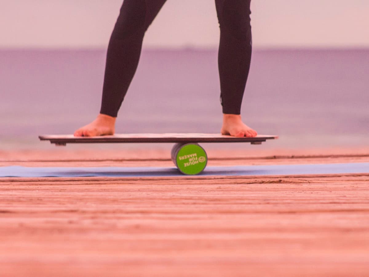 Bare feet finding their balance on a wobbling balance board